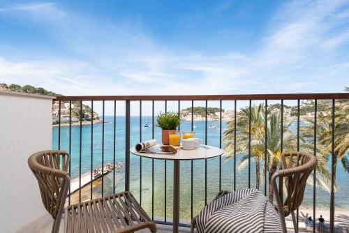 a balcony with a table and chairs and the ocean at Repic Apartments Soller in Port de Soller