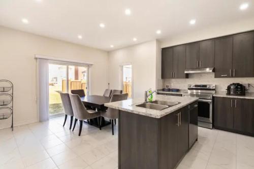 A kitchen or kitchenette at Sweet Suites Oshawa