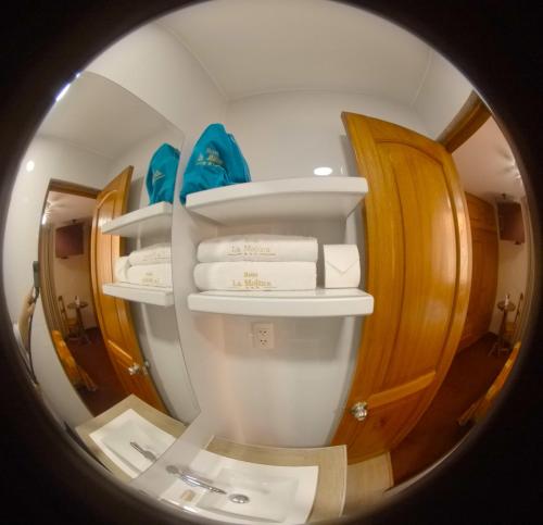 a circular view of a bathroom in an airplane at Hotel La Molina in Lima