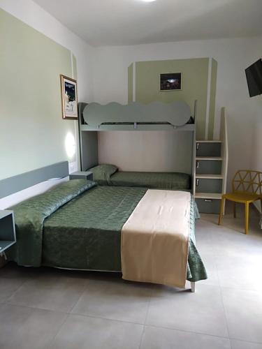 a bedroom with two bunk beds in a room at Antares B&B in Cariati