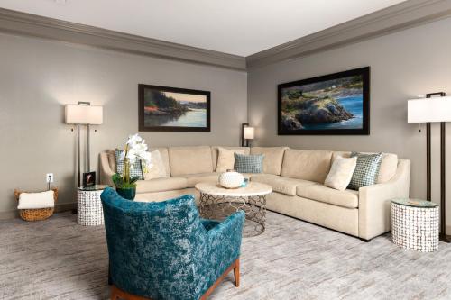 a living room with a couch and a table at Hotel Bellwether on Bellingham Bay in Bellingham