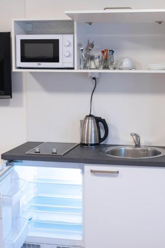 Cuisine ou kitchenette dans l'établissement Zambak Apartments