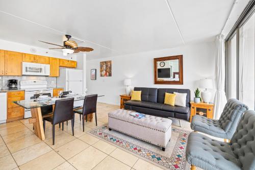 a living room with a couch and a table at Waikiki Banyan T1-3106 in Honolulu