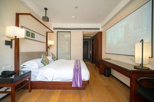 Ένα ή περισσότερα κρεβάτια σε δωμάτιο στο SSAW Boutique Hotel Shanghai Yilin