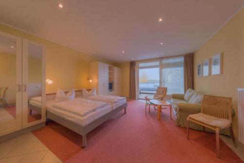 Un pat sau paturi într-o cameră la Strandläufer Classic 214