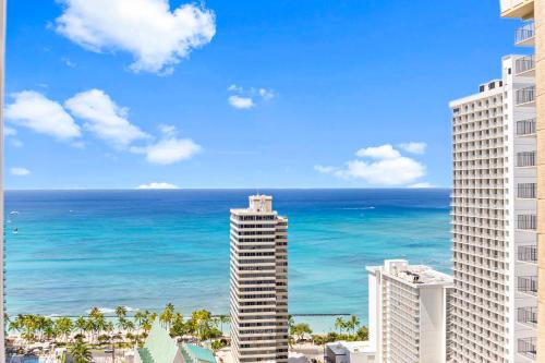 a view of the ocean from the balcony of a building at Waikiki Banyan T1-3204 in Honolulu