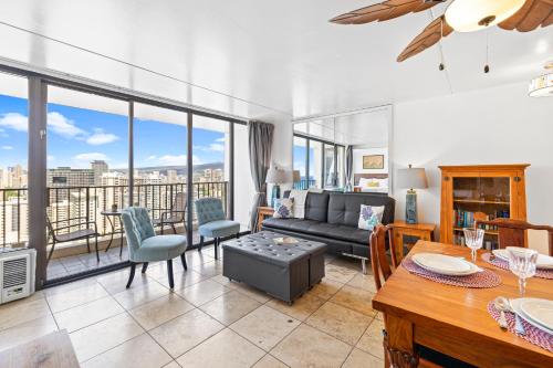 a living room with a couch and a table at Waikiki Banyan T1-3204 in Honolulu