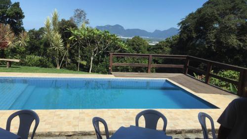a swimming pool in a resort with a view at Sítio Paraiso in Rio de Janeiro