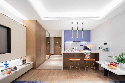 Kuchyň nebo kuchyňský kout v ubytování Changsha Zealandia Serviced Apartment
