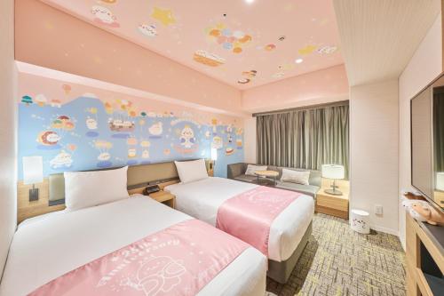 a hotel room with two beds and a wall mural at Villa Fontaine Grand Haneda Airport in Tokyo