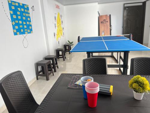 a ping pong table with a ping pong ball at Los Nonos Hostel in Guadalupe