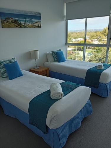 Katil atau katil-katil dalam bilik di Kirra Surf Apartments