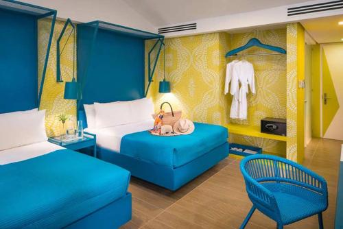 Postel nebo postele na pokoji v ubytování THE ALCOVE Resort Living That Feels Like Home in Palawan