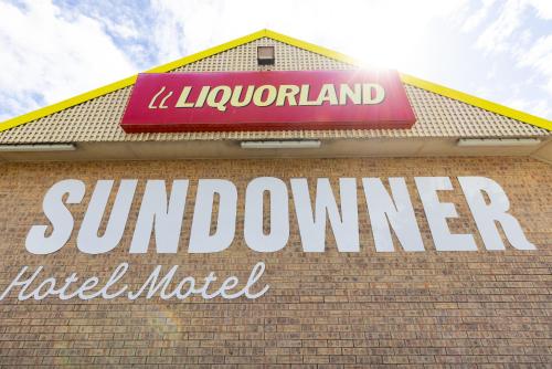 a sign on the side of a sunburner hotel motel at Sundowner Hotel Motel in Caboolture