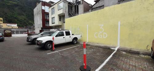 a white truck parked in a parking lot at Casa Gaviota Dorada in Baños