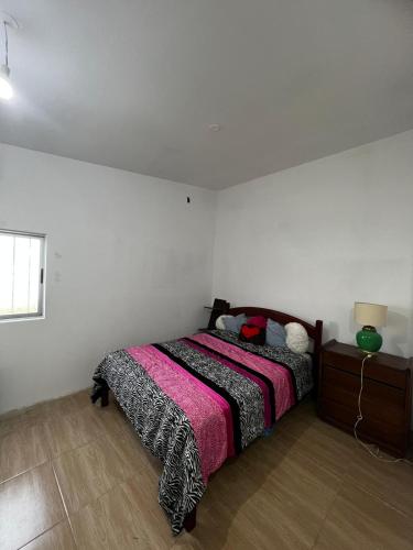 מיטה או מיטות בחדר ב-Casa en El Pinar