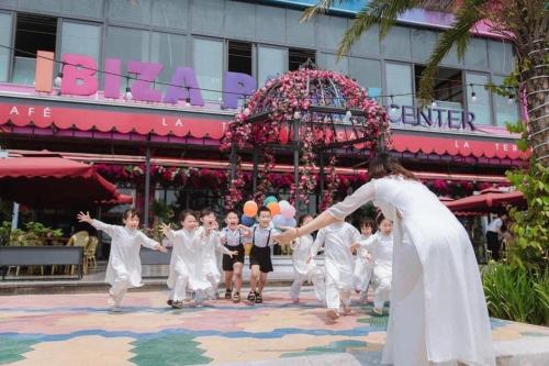 a group of people in white kimonos dancing at Flamingo Hải Tiến - Căn góc 2 Phòng - View 2 mặt biển in Thanh Hóa