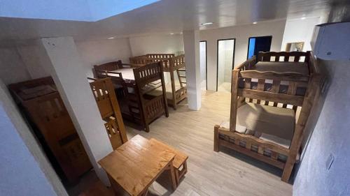 an overhead view of a room with several bunk beds at CD NATUREVIEW in Matangtubig