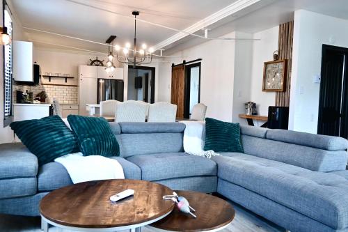 a living room with a blue couch and a table at Alma 2 bedroom Sleeps 6 in Alma