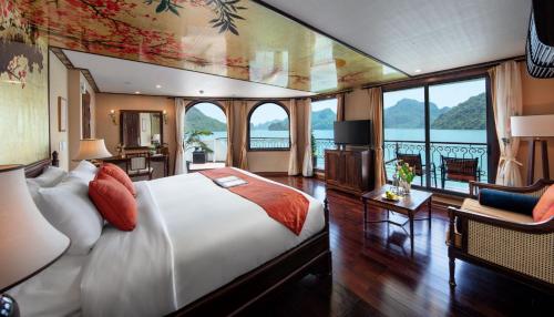 a bedroom with a bed and a view of the water at Indochine Cruise Lan Ha Bay Powered by ASTON in Ha Long