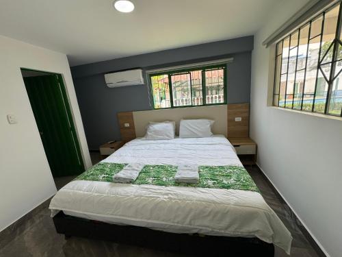 Postel nebo postele na pokoji v ubytování Hotel Maratea Melgar