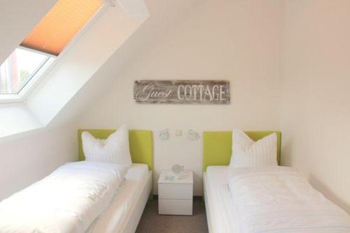 En eller flere senge i et værelse på Fischerhaus Classic 301