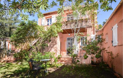 an old building with a table in front of it at 2 Bedroom Stunning Apartment In Afa in Afa