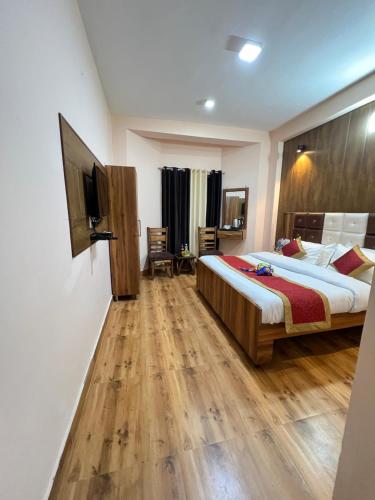a bedroom with a bed and a flat screen tv at Canadian Cottage Dalhousie in Dalhousie