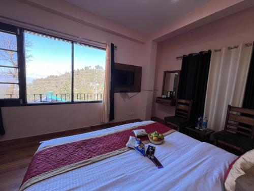 a bedroom with a large bed and a large window at Canadian Cottage Dalhousie in Dalhousie