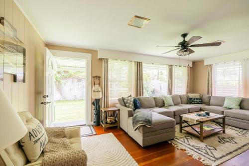 a living room with a couch and a table at Hale Leilani - Hilo 3BR cold AC in Hilo