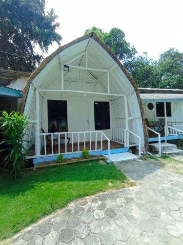 a large white building with a round roof at Hello Bintan in Kangkakawal