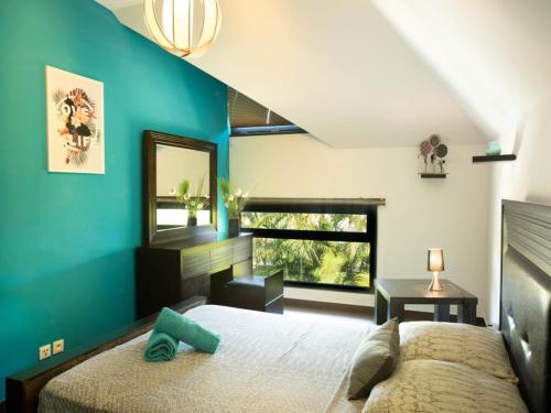 Ένα ή περισσότερα κρεβάτια σε δωμάτιο στο blue lagoon