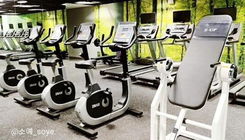 a gym with a row of exercise bikes at Joongmoon ocean stay in Seogwipo