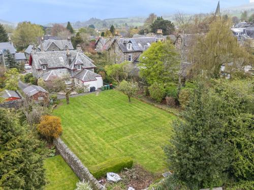 an aerial view of a house with a yard at Edengrove in Aberfeldy