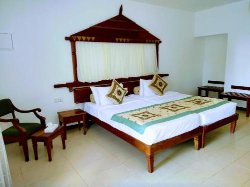 En eller flere senge i et værelse på Randholee Resort & Spa