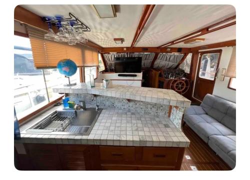 a kitchen and living room in an rv at YACHT OF MY DREAMS in Key Largo