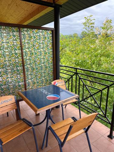 a table and two chairs on a balcony at ЕЛІТ in Svalyava