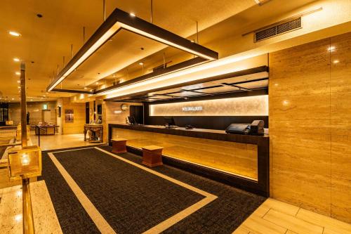 a lobby with a reception desk in a building at New Osaka Hotel in Osaka