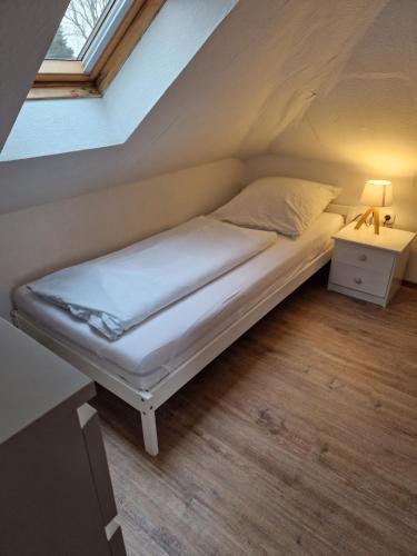 Кровать или кровати в номере Nordseeperle