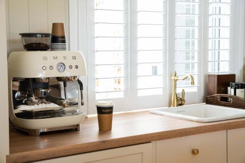 a coffee machine sitting on top of a kitchen counter at Verandah House Country Estate in Mount Tamborine