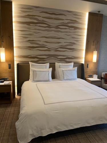 a large white bed in a hotel room at Swissotel Uludag Bursa in Bursa