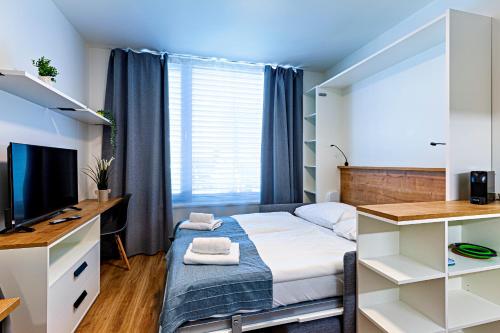 Postel nebo postele na pokoji v ubytování Kora Apartments Andel