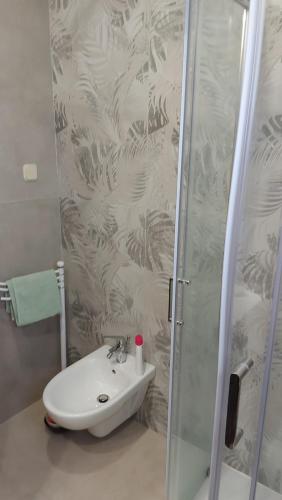 a bathroom with a sink and a shower at Apartment Palma in Mali Lošinj
