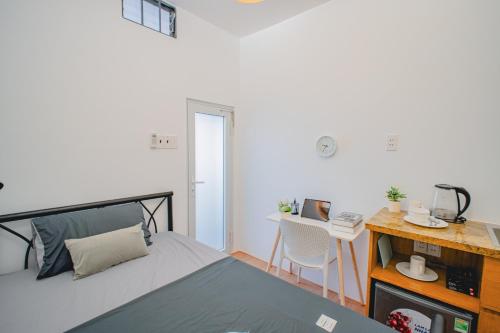 Postel nebo postele na pokoji v ubytování La Casa Di Dicembre HCMC