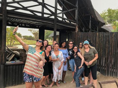 a group of women are posing for a picture at Ditholo Game Lodge Bela Bela in Bela-Bela