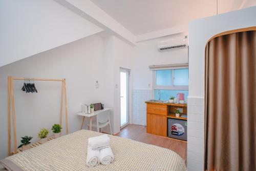 Postel nebo postele na pokoji v ubytování La Casa Di Dicembre HCMC