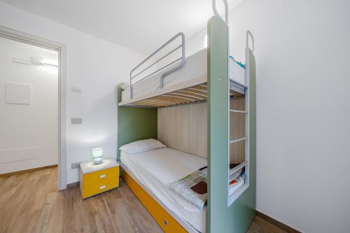 Ένα ή περισσότερα κρεβάτια σε δωμάτιο στο Residenza Stella Alpina