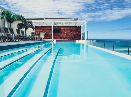 a swimming pool with a view of the ocean at Great Gravity Hotel in Durban