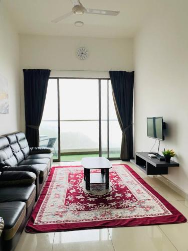a living room with a couch and a table at Home Garden - Palas Horizon, Brinchang Cameron Highlands in Cameron Highlands