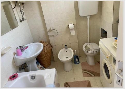 a bathroom with a sink and a toilet at Anako in Novi Vinodolski